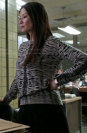 Joan’s grey zebra striped sweater on Elementary