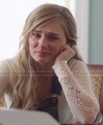 Scarlett’s white crochet sleeve top and denim overalls on Nashville