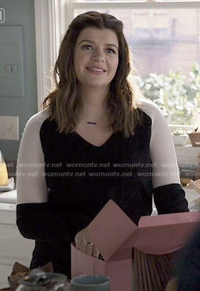 Annie’s black and white colorblock sweater on Marry Me