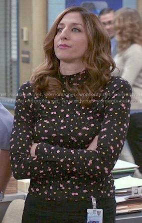 Gina’s black floral mock-neck top on Brooklyn Nine-Nine