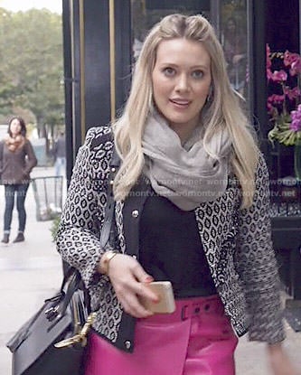 Kelsey’s black and white patterned jacket and pink leather skirt on Younger