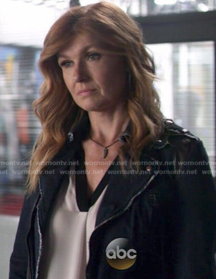 Rayna’s white blouse with black trim on Nashville