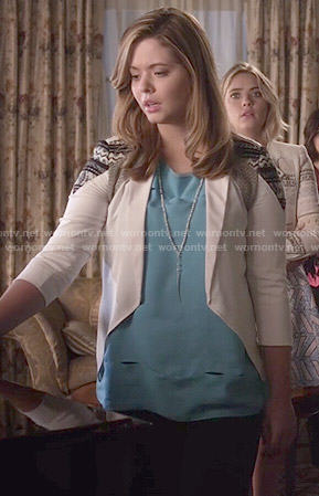 Ali’s blue cutout top and white jacket on Pretty Little Liars