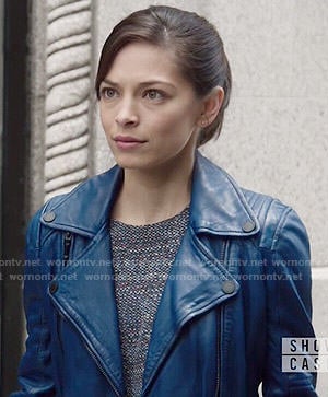 Cat’s blue leather moto jacket and layered top on Beauty and the Beast