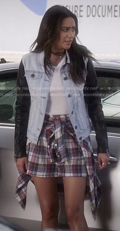 Emily’s plaid shorts and denim jacket with leather sleeves on Pretty Little Liars