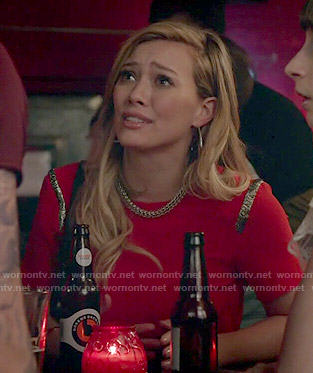Kelsey’s red top with metallic insets on Younger