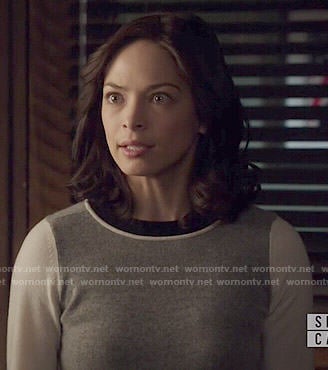 Cat’s grey sweater with white sleeves on Beauty and the Beast