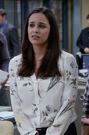 Amy’s white floral v-neck blouse on Brooklyn Nine-Nine