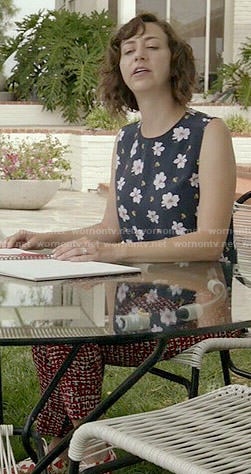 Carol’s navy floral sleeveless top on Last Man on Earth