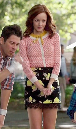 Cassandra’s black and yellow floral skirt and coral printed cardigan on The Librarians