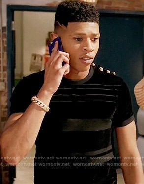 Hakeem’s black striped t-shirt with gold shoulder buttons on Empire