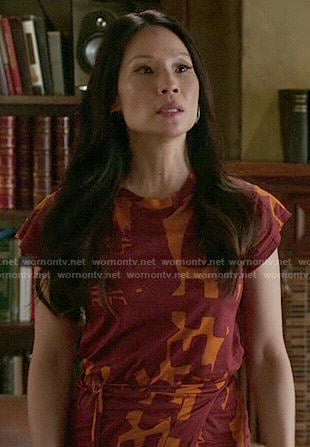 Joan’s orange and red printed dress on Elementary