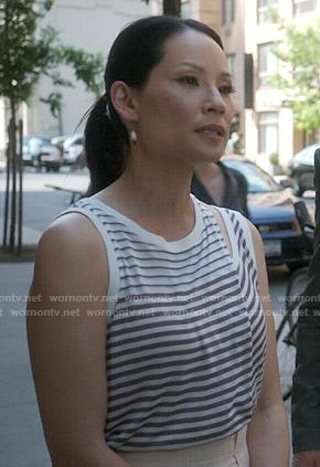 Joan’s striped tank top with cutout shoulder on Elementary