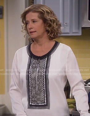 Vanessa’s white blouse with black lace front on Last Man Standing