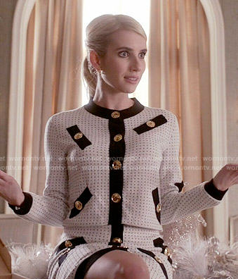 Chanel’s white jacket and skirt set with black trim and gold buttons on Scream Queens