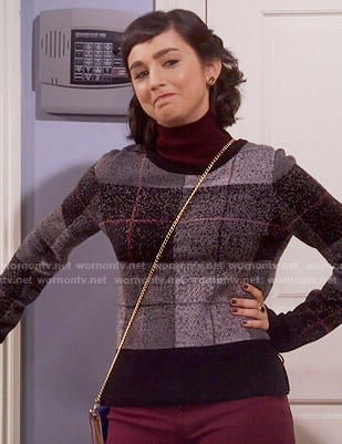 Mandy’s black plaid sweater on Last Man Standing