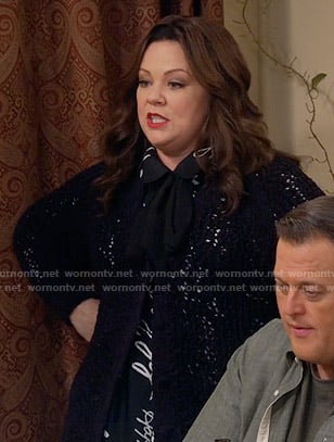 Molly’s black words print blouse and crochet cardigan on Mike and Molly