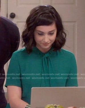 Mandy’s green tie-neck blouse on Last Man Standing