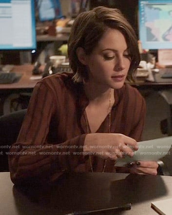 Thea’s dark red striped blouse on Arrow