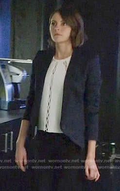 Thea’s white cutout inset top and diamond textured blazer on Arrow