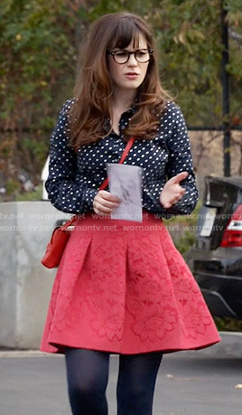 Jess’s navy polka dot shirt and red skirt on New Girl