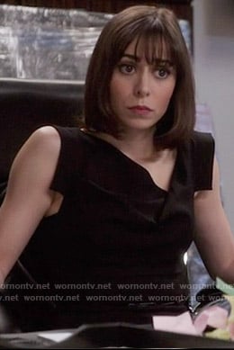 Whitney’s black asymmetrical neck dress on The Mindy Project