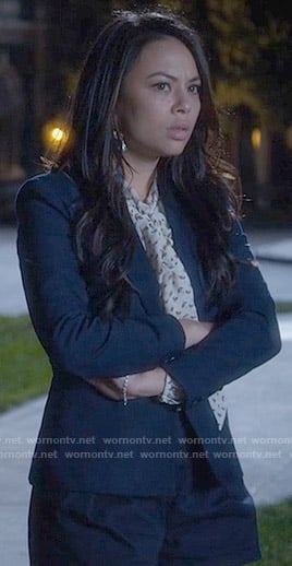 Mona’s printed tie neck blouse and navy shorts on Pretty Little Liars