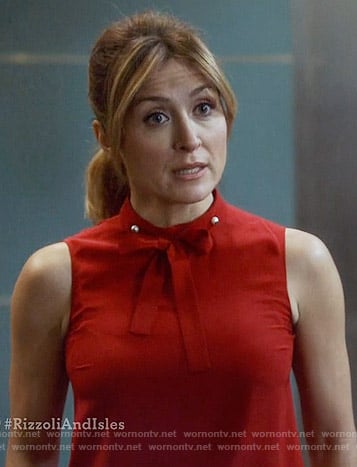 Maura’s red tie neck top with pearls on Rizzoli and Isles