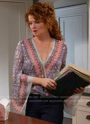 Evelyn’s blue and red printed wrap blouse on Devious Maids