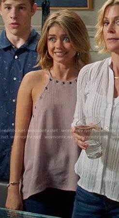 Haley’s pink grommet trim top on Modern Family