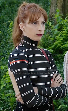 Lauren’s black striped long sleeve top with cutout back on Younger