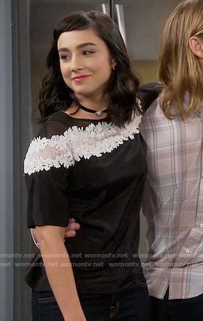Mandy’s black top with white lace stripe on Last Man Standing