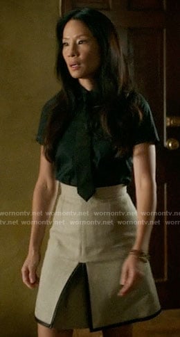 Joan’s beige skirt with black trim on Elementary