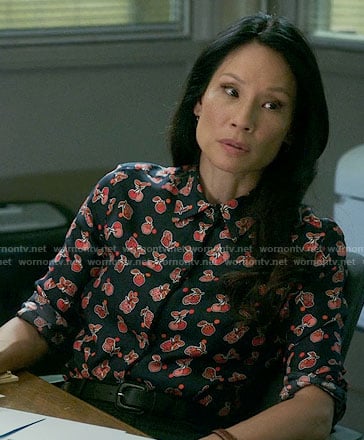 Joan’s navy and red fruit print shirt on Elementary
