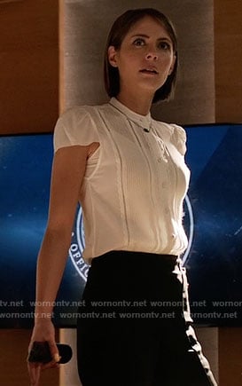 Thea’s white pintuck top and turquoise necklace on Arrow