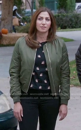 Gina’s black bird print top and green bomber jacket on Brooklyn Nine-Nine