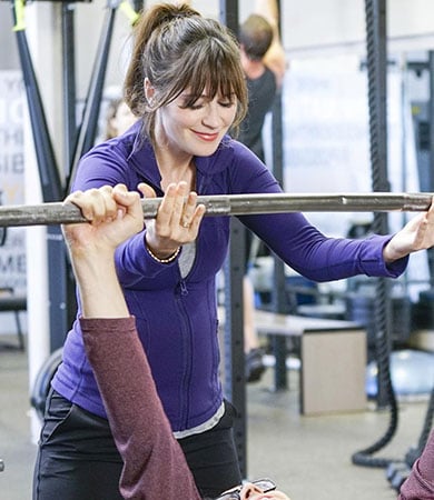 Jess’s violet workout jacket on New Girl