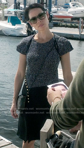 Joan’s black asymmetric dress with striped pattern top on Elementary