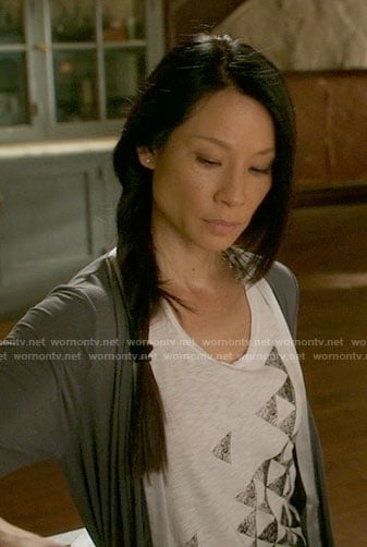Joan’s triangle print tank top and grey robe on Elementary