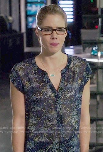 Felicity’s navy floral split-neck top on Arrow