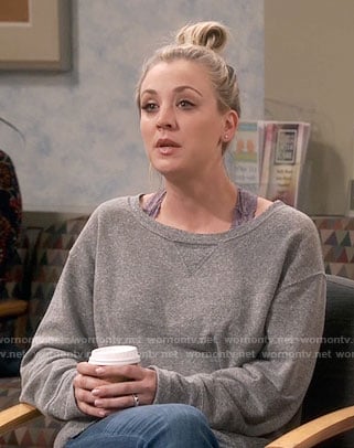 Penny’s grey sweatshirt and purple lace bra on The Big Bang Theory