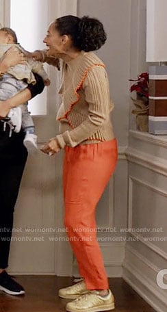 Rainbow’s tan ruffled sweater with orange trim on Black-ish