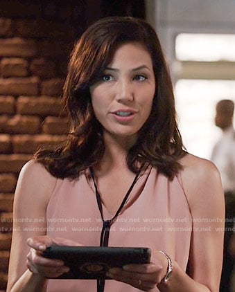 Angela’s pink ruffled neck top with black tie on Bones