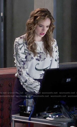 Caitlin’s floral top with ruffled sleeves on The Flash