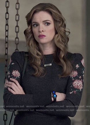 Caitlin’s grey sweater with rose print sleeves on The Flash
