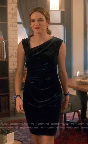 Caitlin’s green velvet dress with asymmetrical neckline on The Flash
