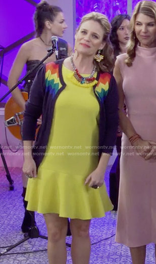 Kimmy’s yellow dress, rainbow striped cardigan and taco clutch on Fuller House