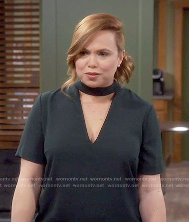 Kristin’s dark green dress with triangle cutout on Last Man Standing