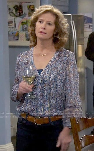 Vanessa’s blue printed blouse with metallic stripes on Last Man Standing