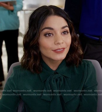 Emily’s teal green tie neck blouse on Powerless